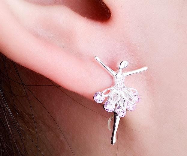 woman wearing silver and pink cubic zirconia ballerina earrings